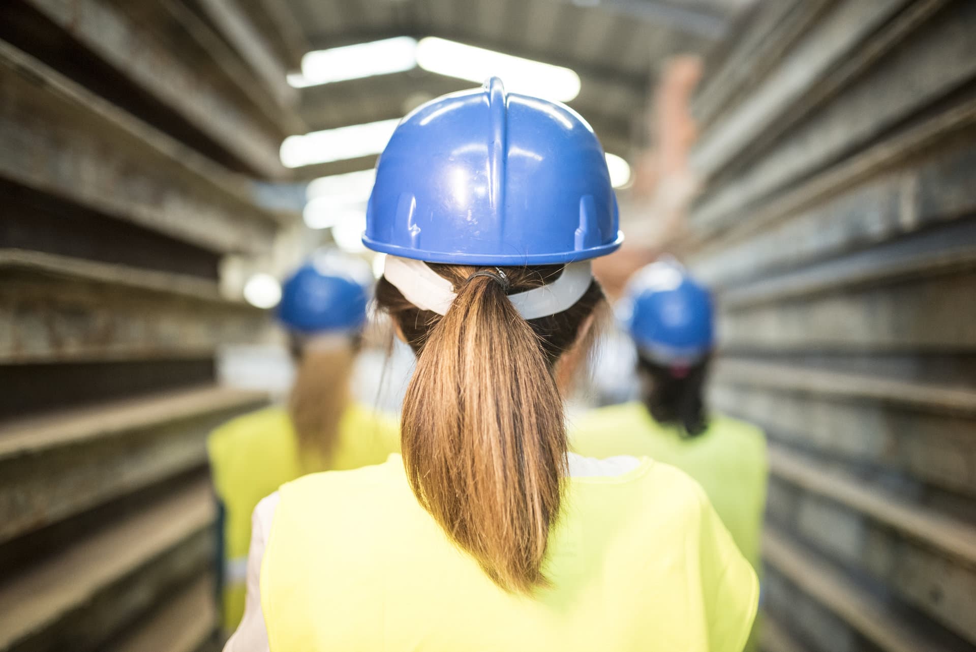 Woman with hard hat wearing a ponytail